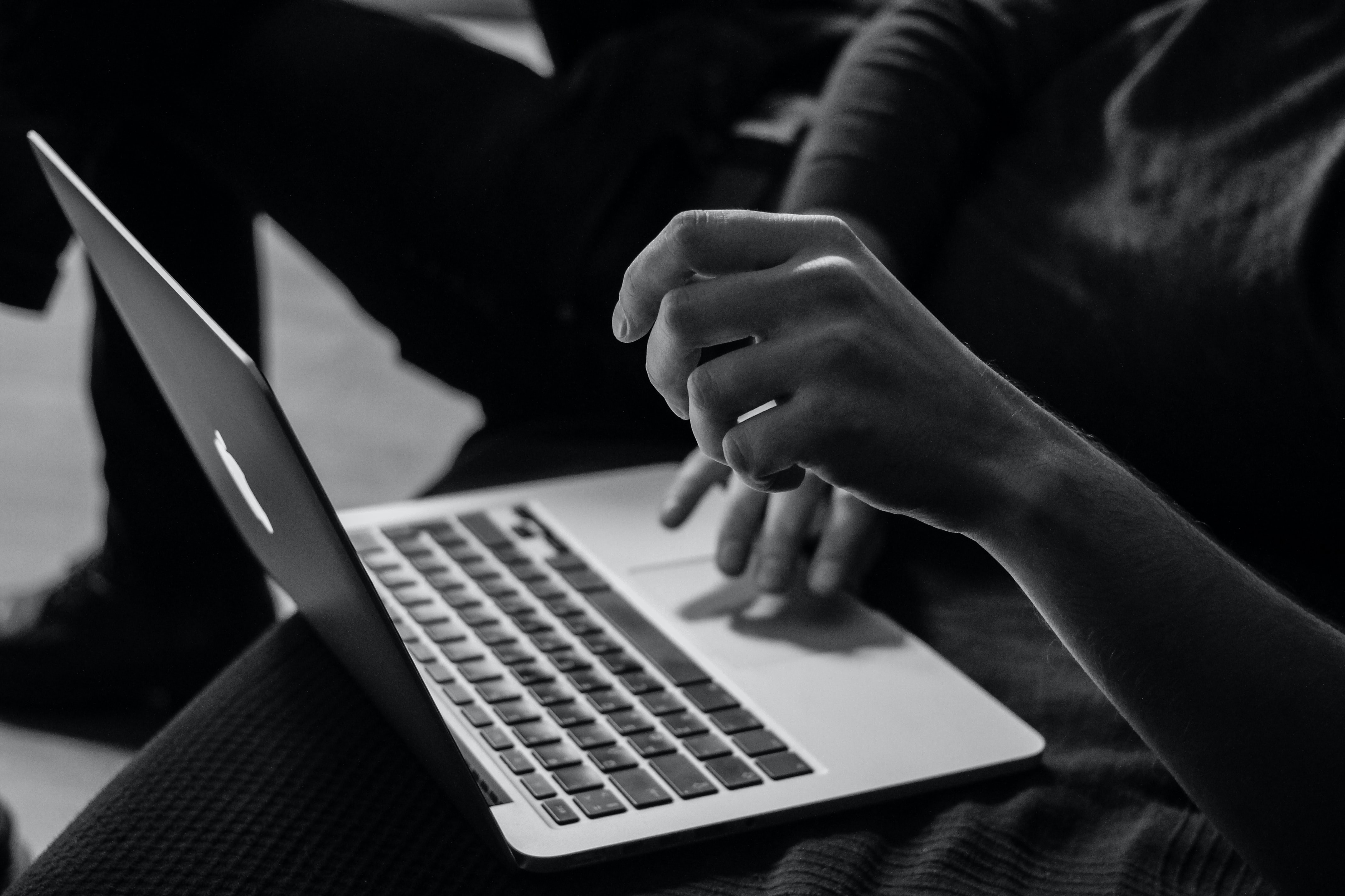 Someone's hand on a laptop 
