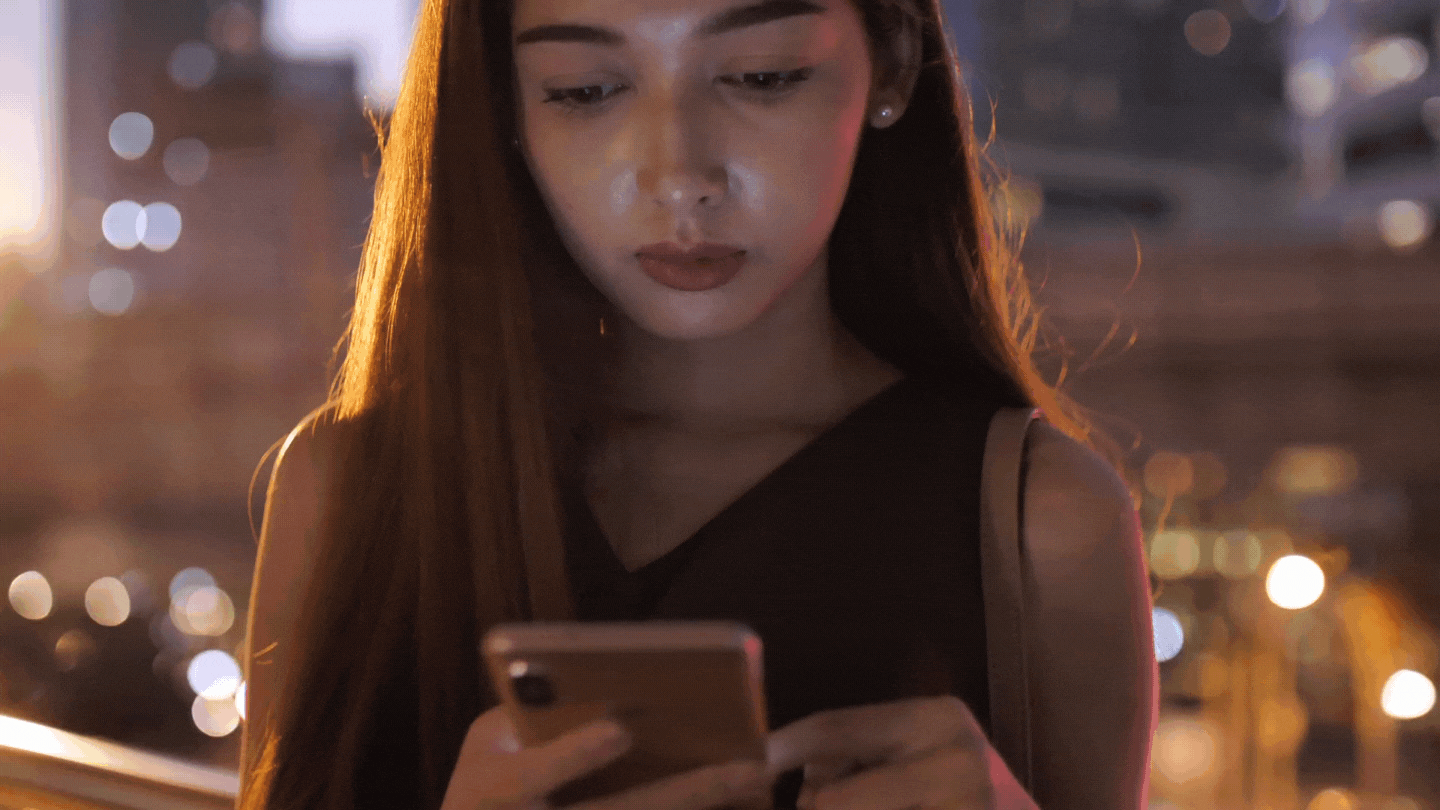 woman looking at her cellphone